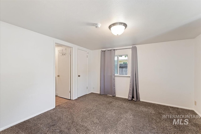 216 9th Ave N, Nampa, ID 83687 - unfurnished bedroom featuring carpet floors and baseboards