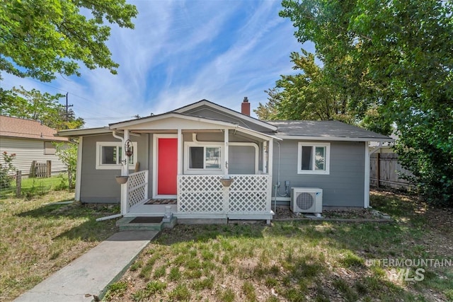 216 9th Ave N, Nampa, ID 83687 - bungalow-style home with a porch, a cooling unit, and a chimney