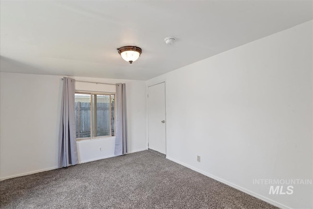 216 9th Ave N, Nampa, ID 83687 - carpeted empty room featuring a smoke detector and baseboards