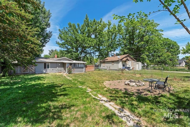 216 9th Ave N, Nampa, ID 83687 - view of yard featuring a fire pit