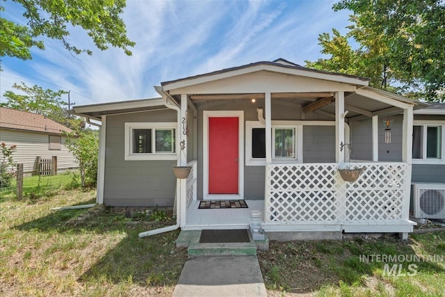 216 9th Ave N, Nampa, ID 83687 - view of front of home featuring a porch and ac unit
