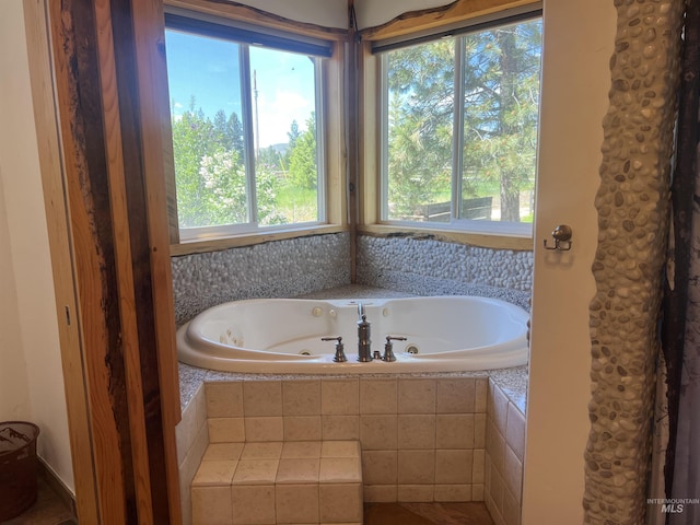 bathroom featuring tiled bath