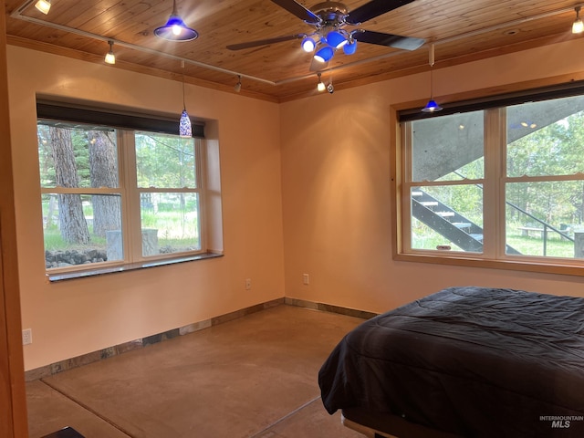 bedroom with wooden ceiling, track lighting, and ceiling fan