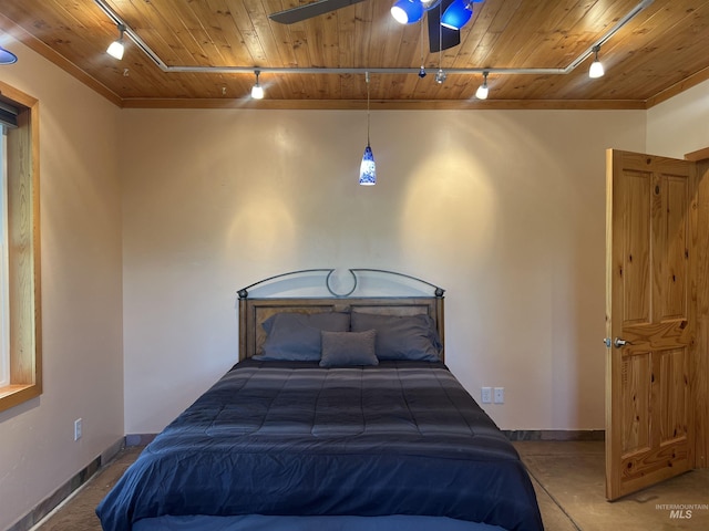 bedroom featuring ceiling fan, crown molding, track lighting, and wooden ceiling