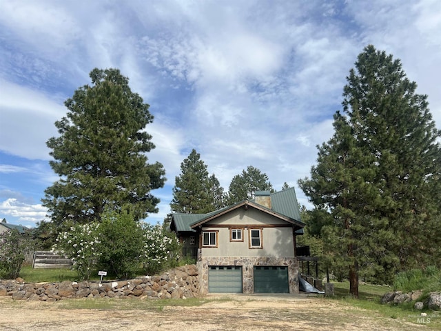 view of property exterior with a garage