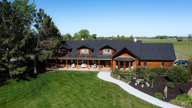 rear view of house with a yard and a patio