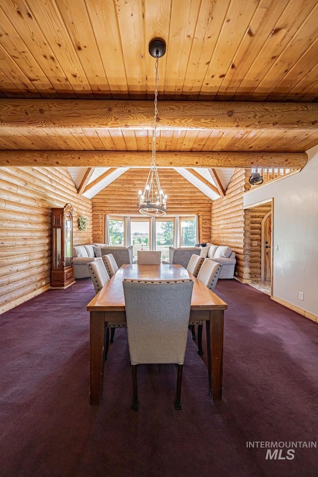 dining area with a chandelier, dark colored carpet, beamed ceiling, and baseboards