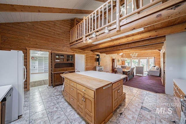 kitchen featuring high vaulted ceiling, wood counters, beam ceiling, dishwasher, and a wood stove