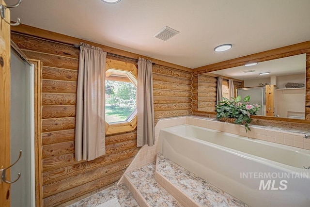 full bath featuring a garden tub, visible vents, and tile patterned floors