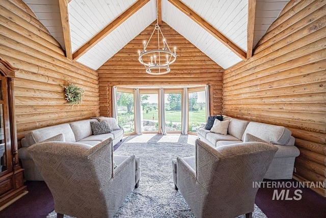 living area with high vaulted ceiling, beamed ceiling, log walls, and an inviting chandelier