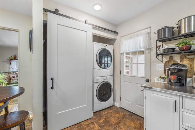 3233 8th St, Lewiston, ID 83501 - laundry room with a barn door and stacked washer and clothes dryer
