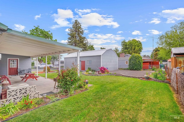 3233 8th St, Lewiston, ID 83501 - view of grassy yard with an outdoor structure and a patio area