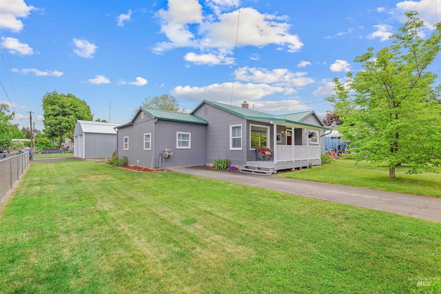 3233 8th St, Lewiston, ID 83501 - view of front of property with a porch, metal roof, a chimney, and asphalt driveway