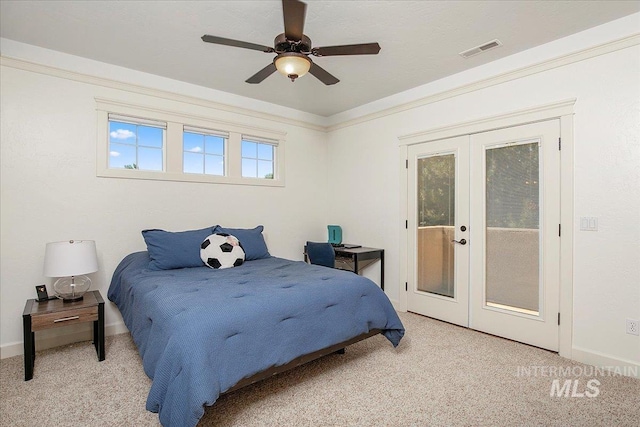 carpeted bedroom with french doors, ceiling fan, crown molding, and access to exterior