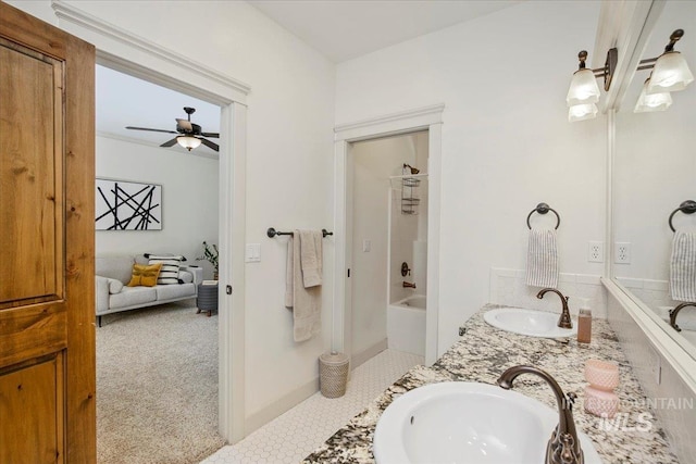 bathroom with shower / tub combination, vanity, and ceiling fan