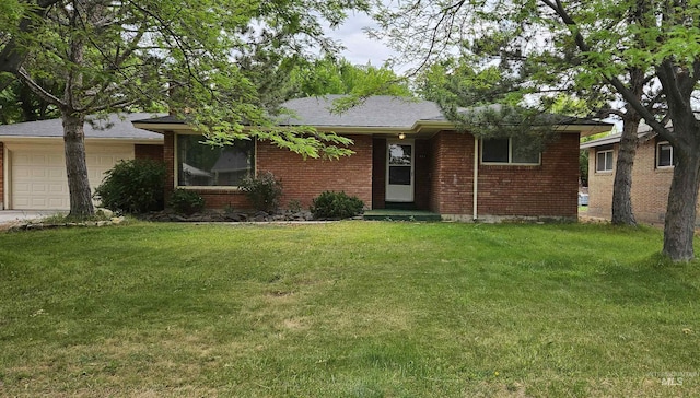 604 Monte Vis, Twin Falls, ID 83301 - ranch-style house with an attached garage, brick siding, a front lawn, and concrete driveway