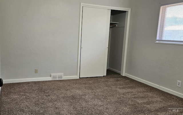 604 Monte Vis, Twin Falls, ID 83301 - unfurnished bedroom with dark colored carpet and a closet