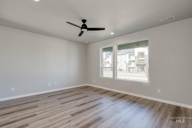 3542 W Littleton Dr, Meridian, ID 83642 - empty room featuring wood finished floors, baseboards, recessed lighting, and ceiling fan