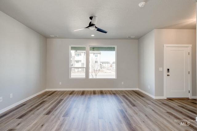 3542 W Littleton Dr, Meridian, ID 83642 - empty room with a smoke detector, a ceiling fan, light wood-style flooring, and baseboards