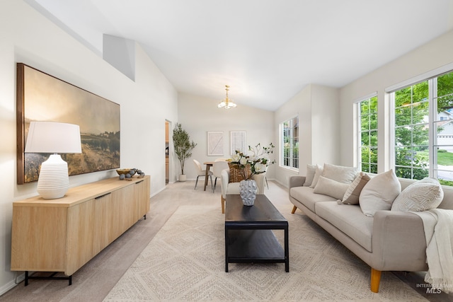 6460 S Lodgepole Pl, Boise, ID 83716 - living area featuring lofted ceiling, light carpet, a chandelier, and baseboards