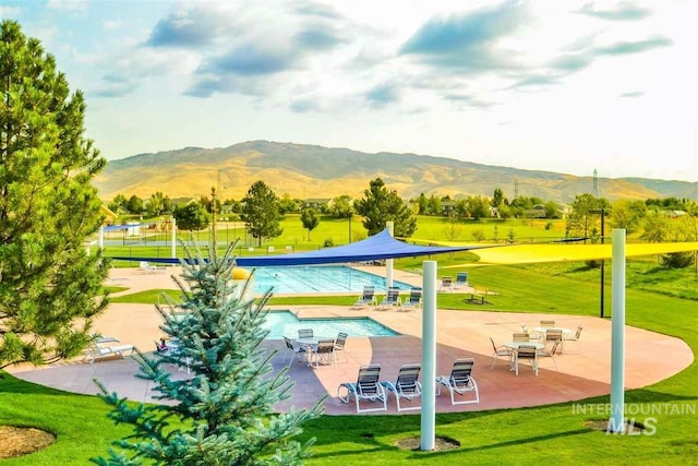 6460 S Lodgepole Pl, Boise, ID 83716 - view of community featuring a mountain view, a yard, and a patio