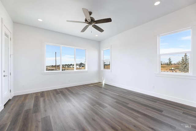 unfurnished room with dark wood finished floors, recessed lighting, a ceiling fan, and baseboards