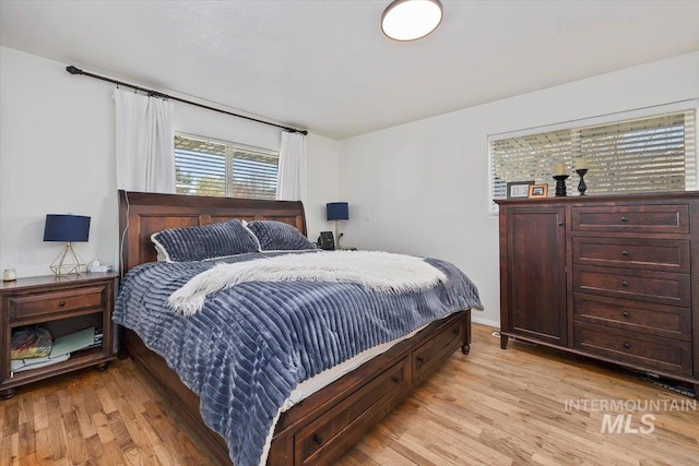 bedroom featuring light wood-style flooring