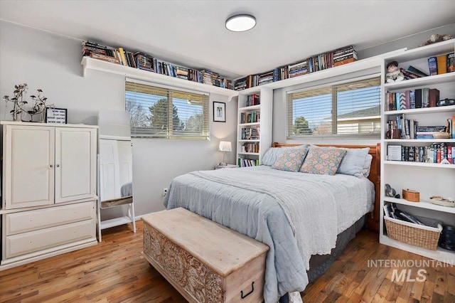 bedroom featuring wood finished floors