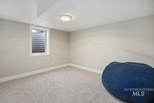 interior space with carpet flooring and baseboards