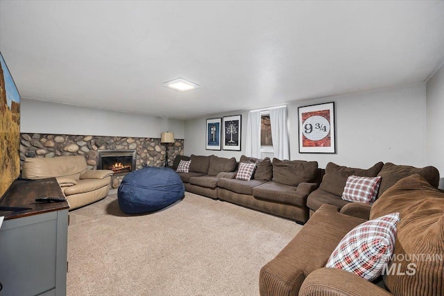 carpeted living area featuring a fireplace