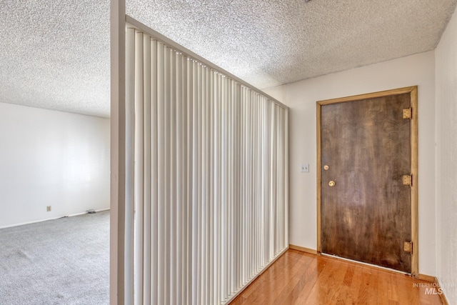 412 N Purdue St, Boise, ID 83706 - entryway featuring a textured ceiling, baseboards, and wood finished floors