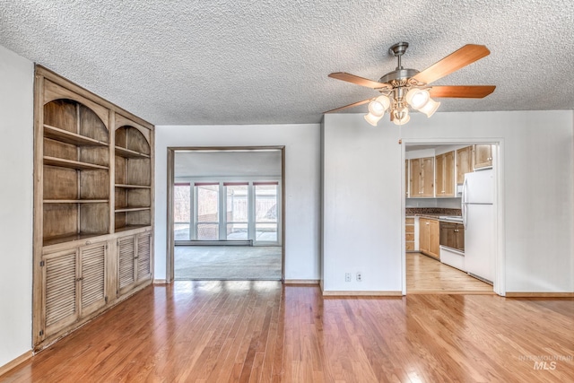 412 N Purdue St, Boise, ID 83706 - unfurnished living room with a ceiling fan, light wood-style floors, a textured ceiling, and baseboards