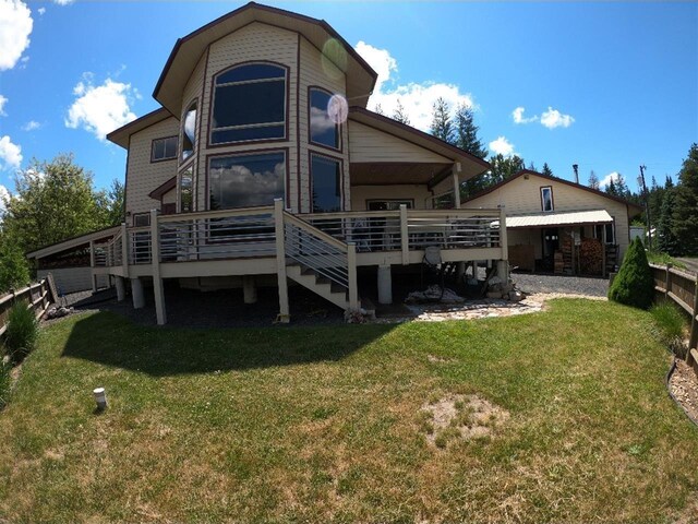 204 S 2nd St, Elk River, ID 83827 - rear view of house with a wooden deck and a yard