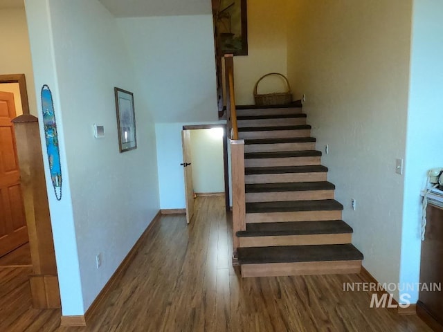 204 S 2nd St, Elk River, ID 83827 - stairway with wood finished floors and baseboards
