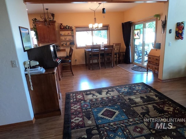 204 S 2nd St, Elk River, ID 83827 - dining space with a chandelier, wood finished floors, and plenty of natural light