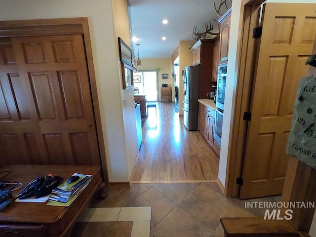 204 S 2nd St, Elk River, ID 83827 - hall with light tile patterned floors and recessed lighting
