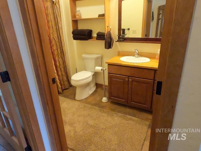 204 S 2nd St, Elk River, ID 83827 - bathroom with toilet and vanity