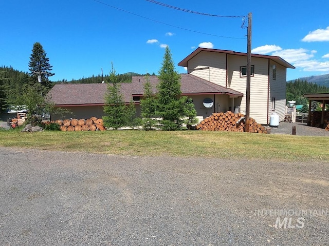 204 S 2nd St, Elk River, ID 83827 - view of side of home featuring a lawn