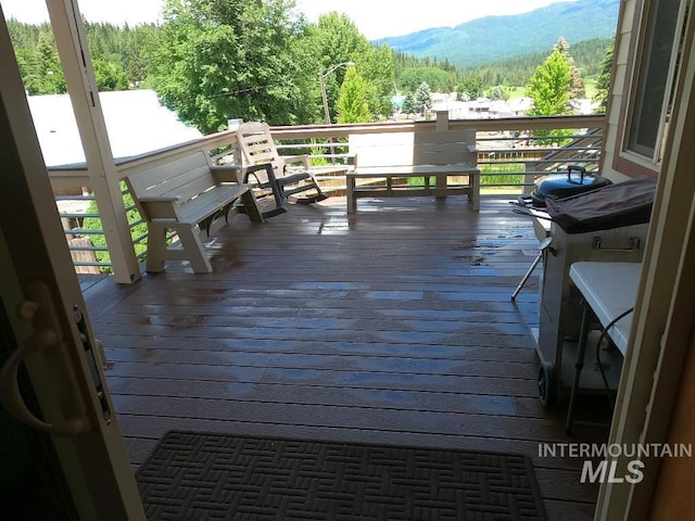 204 S 2nd St, Elk River, ID 83827 - wooden terrace with a mountain view, area for grilling, and a forest view