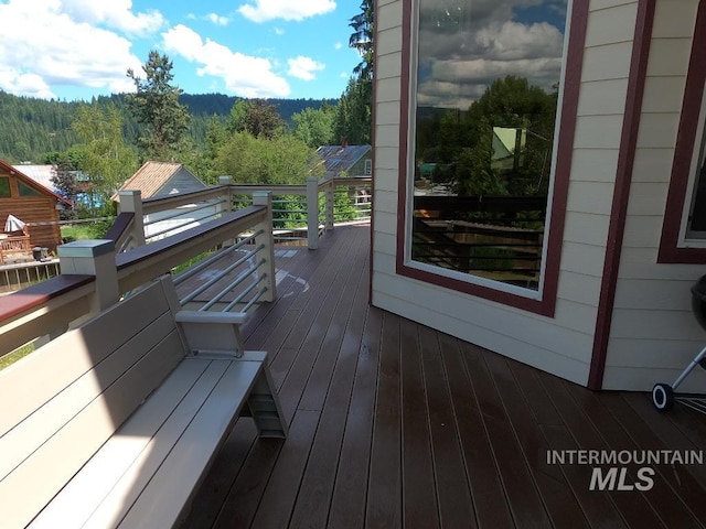 204 S 2nd St, Elk River, ID 83827 - wooden deck featuring a view of trees