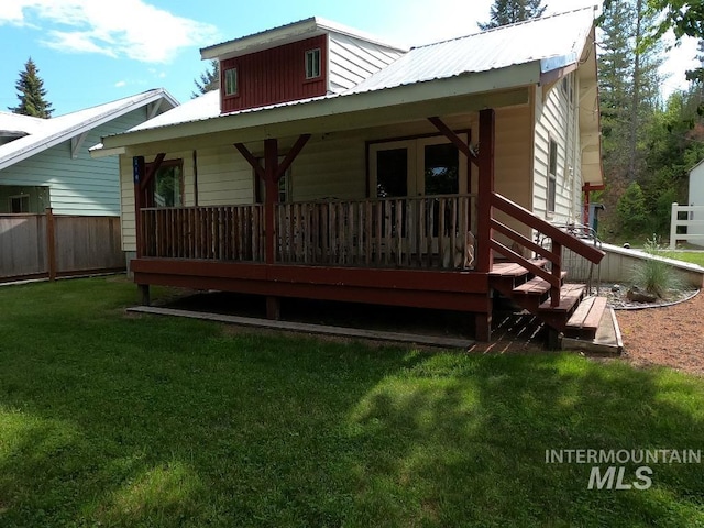 204 S 2nd St, Elk River, ID 83827 - back of house featuring a metal roof and a porch