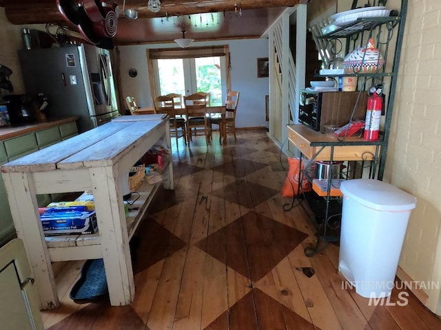 204 S 2nd St, Elk River, ID 83827 - kitchen featuring stainless steel refrigerator with ice dispenser and wood finished floors