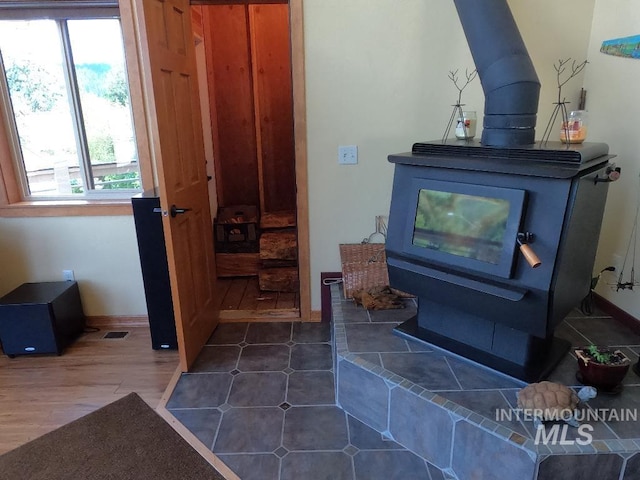 204 S 2nd St, Elk River, ID 83827 - detailed view of a wood stove and wood finished floors