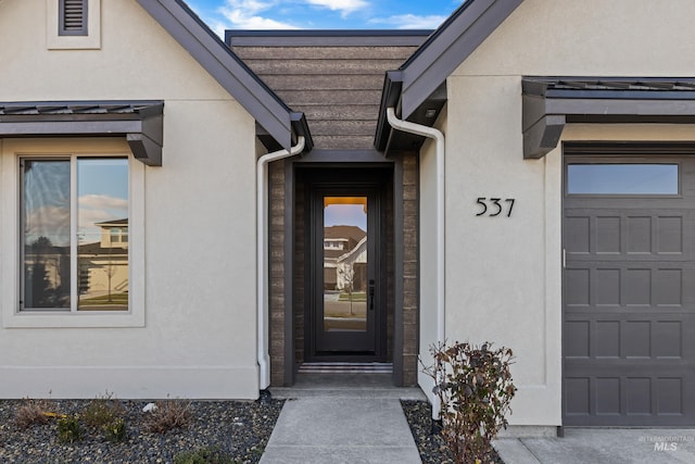 entrance to property featuring a garage