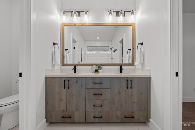 bathroom with toilet, tile patterned floors, walk in shower, and vanity