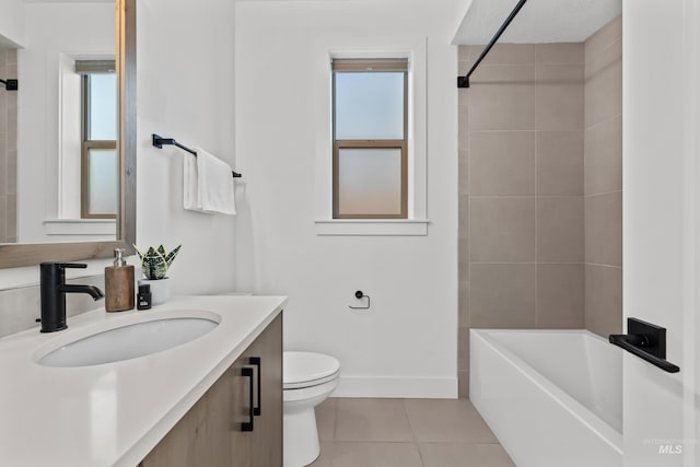 full bathroom with vanity, a wealth of natural light, tile patterned floors, and toilet