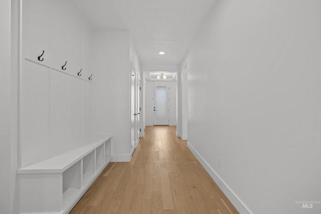 hall with light hardwood / wood-style flooring