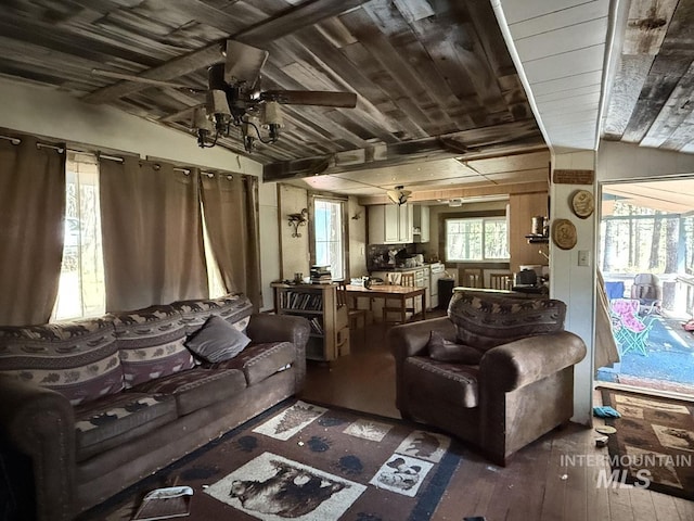 living room with hardwood / wood-style flooring, a ceiling fan, and wooden ceiling