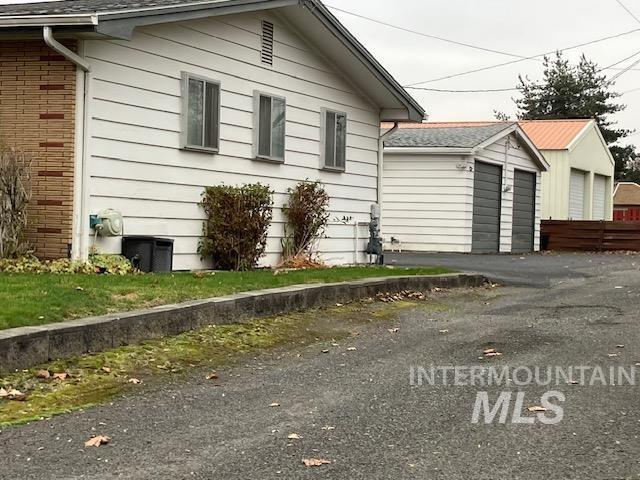 view of side of property with a garage