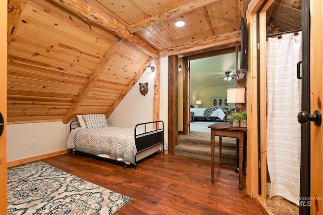 bedroom featuring vaulted ceiling with beams, wood finished floors, wood ceiling, and baseboards